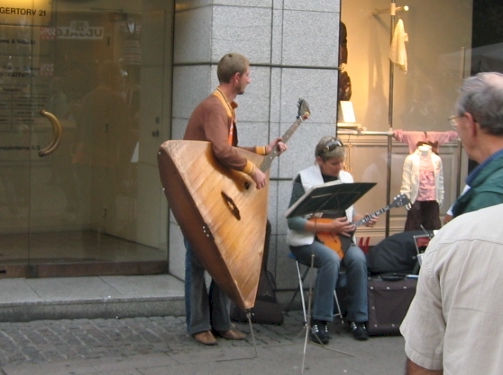 large triangular bass with stand